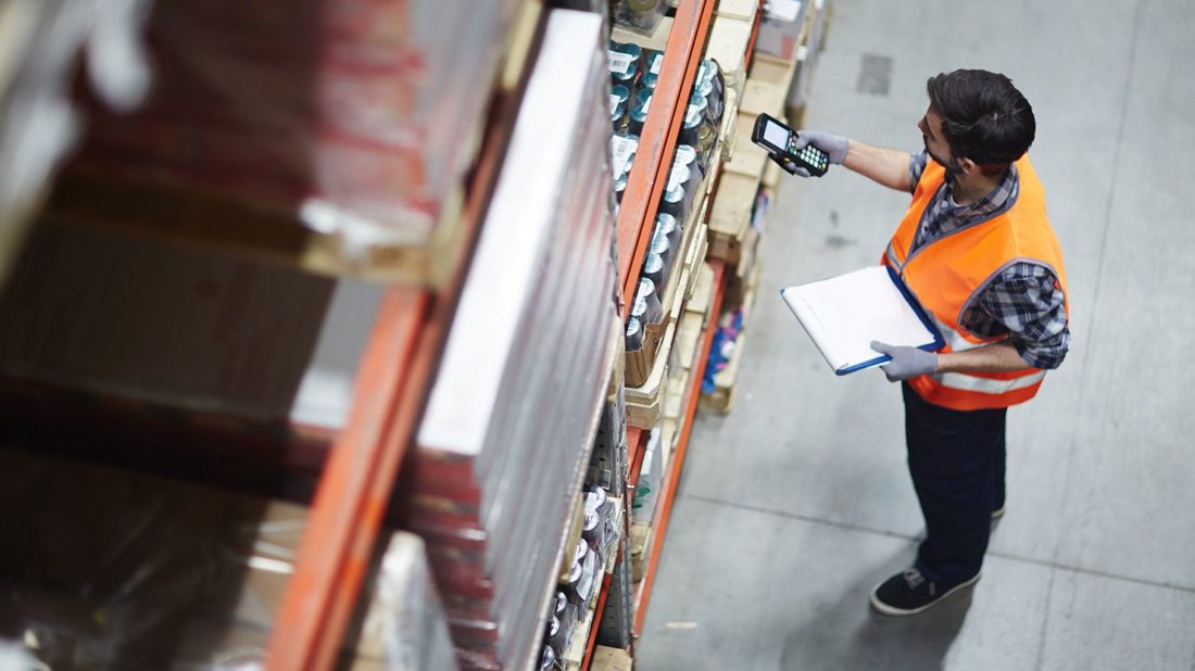 view from above of man doing inventory in warehouse